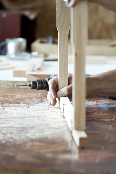 Man's arms drill lath in the workshop — Stock Photo, Image