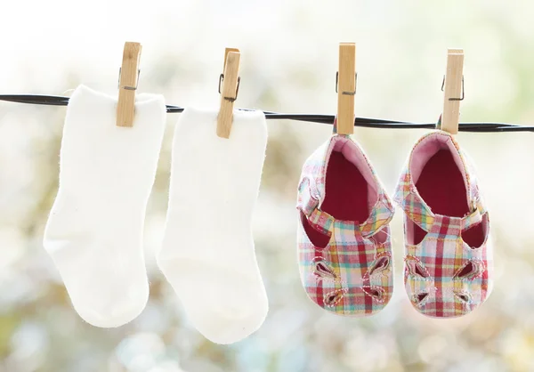 Hanging baby clothes — Stock Photo, Image