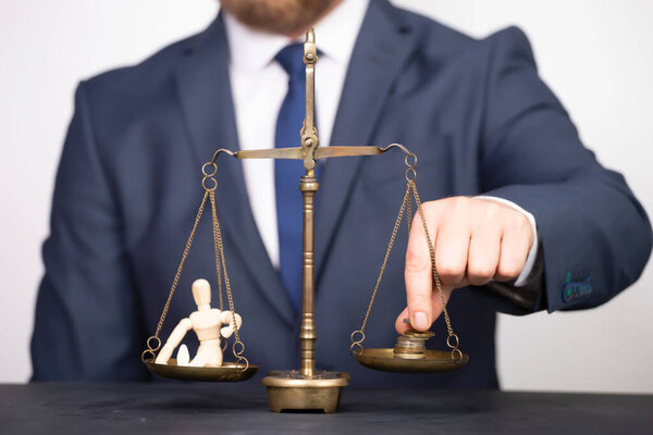 Conceptual financial and business photo of scale with people on one pan and money on the other showing balance