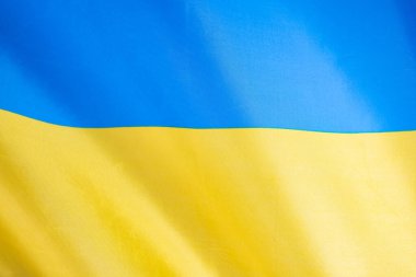 Ukrayna bayrağı, UA. Mavi ve sarı renkler. Yakın çekim, arkaplan