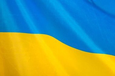 Ukrayna bayrağı, UA. Mavi ve sarı renkler. Yakın çekim, arkaplan