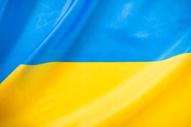 Ukrayna bayrağı, UA. Mavi ve sarı renkler. Yakın çekim, arkaplan