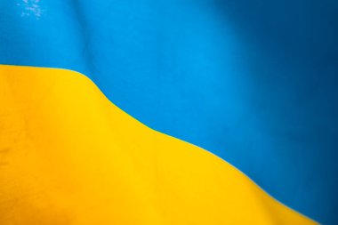 Ukrayna bayrağı, UA. Mavi ve sarı renkler. Yakın çekim, arkaplan