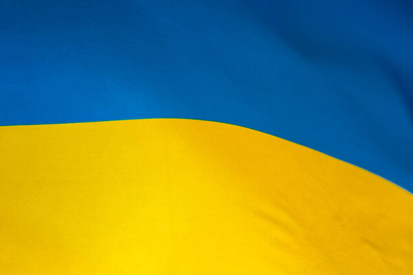 Flag of Ukraine, UA. Blue and yellow colors. Close up shot, background