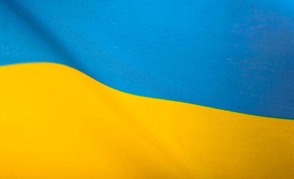 Flag of Ukraine. Blue and yellow colors. Close up shot, background