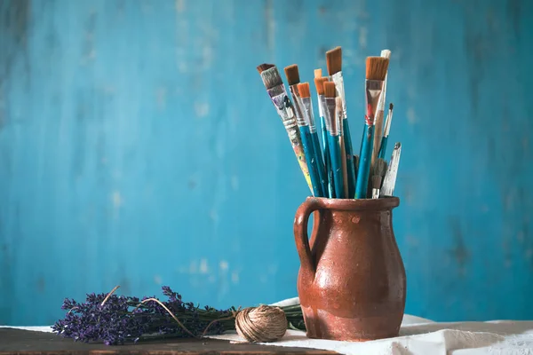 Still Life Paint Brushes Clay Jug Lavender Flower Vintage Turquoise — Photo