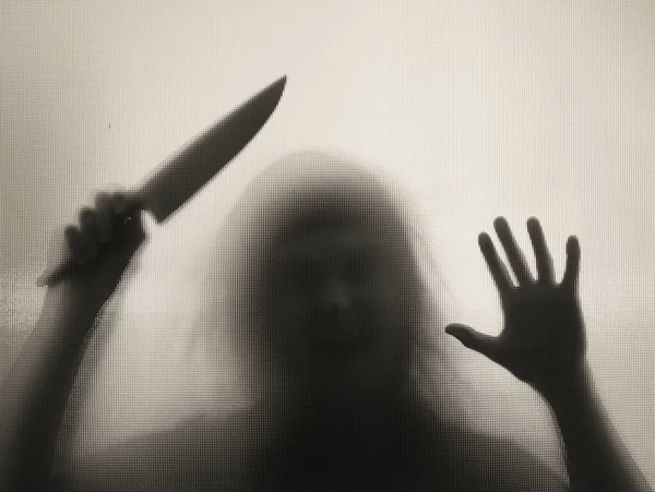 Horror Halloween Háttér Shadowy Figura Üveg Mögött Kezében Egy Kést — Stock Fotó