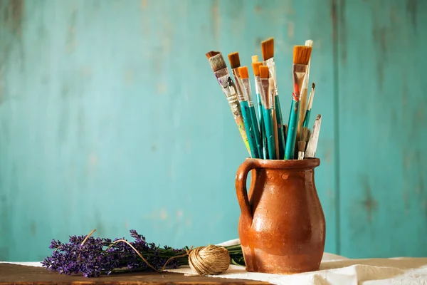 Still Life Paint Brushes Clay Jug Lavender Flower Vintage Turquoise — Photo
