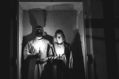 Ghosts in abandoned, haunted house. Horror scene of scary spirit of a couple, halloween concept.