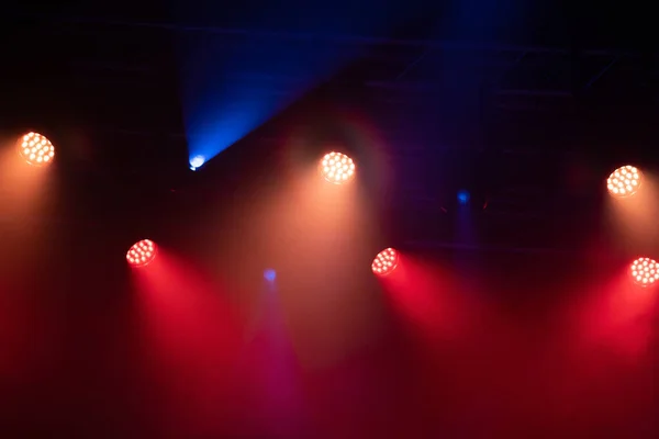 Stage light with colored spotlights and smoke. Concert and theatre scene