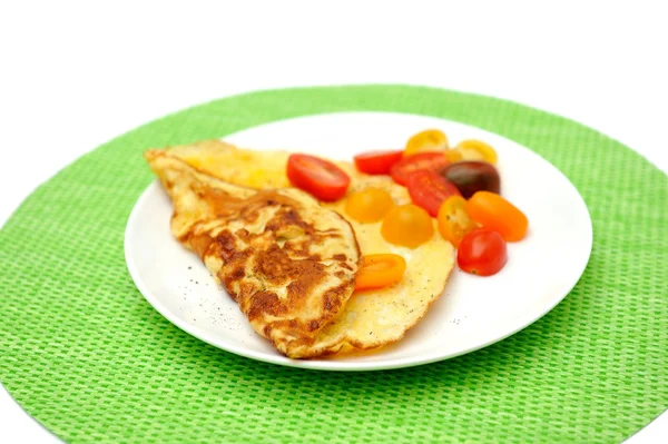Omelet with tomatoes on the white plate — Stock Photo, Image