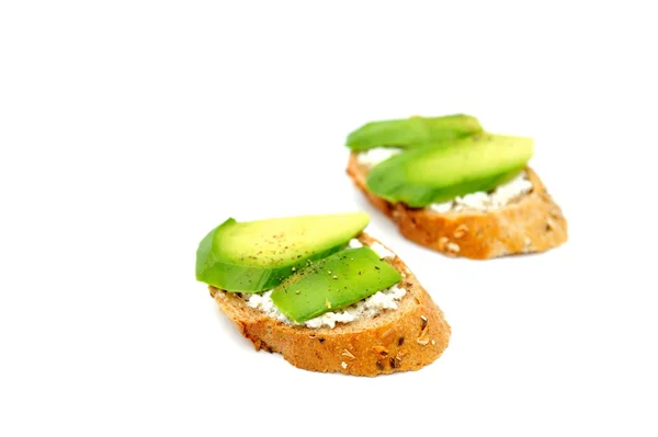 Gesunde Avocado-Snacks auf weißem Hintergrund lizenzfreie Stockfotos
