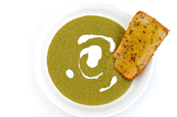 Суп зі шпинату з хлібним крекером Стокова Картинка