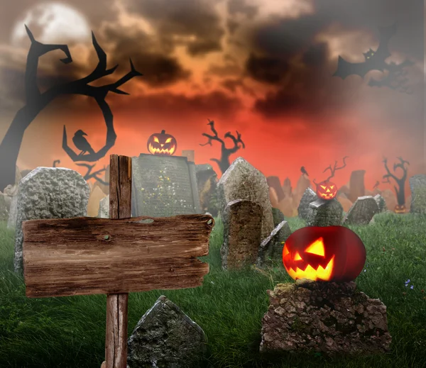 Cemetery with glowing pumpkins — Stock Photo, Image