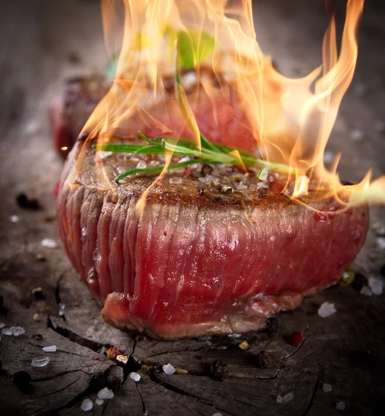 Bloody bbq steaks — Stock Photo, Image