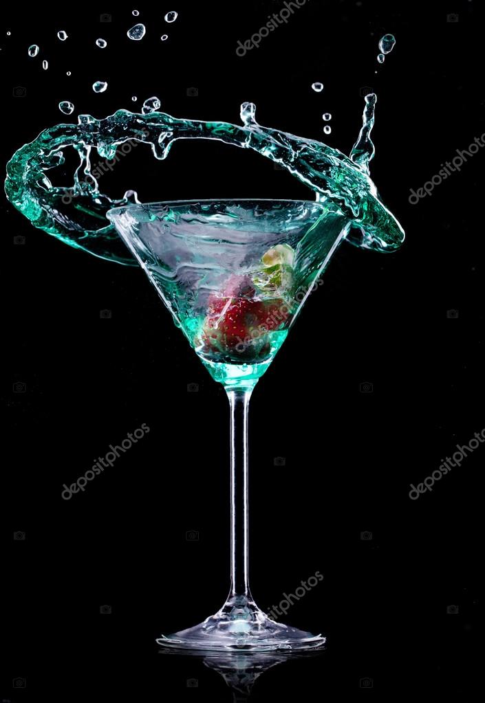 A Martini Glass On A Black Background Stock Photo - Download Image