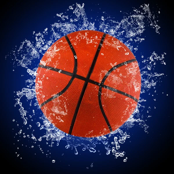 Basketball ball in splashing water — Stock Photo, Image