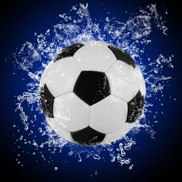 Soccer ball in splashing water — Stock Photo, Image