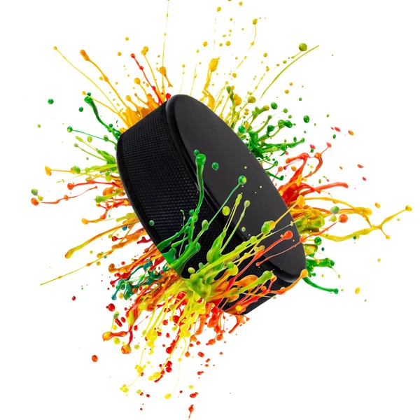 Colorful splash with hockey puck — Stock Photo, Image