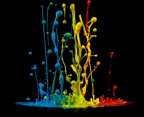 Colorful paint splashing — Stock Photo, Image