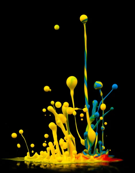 Colorful paint splashing — Stock Photo, Image