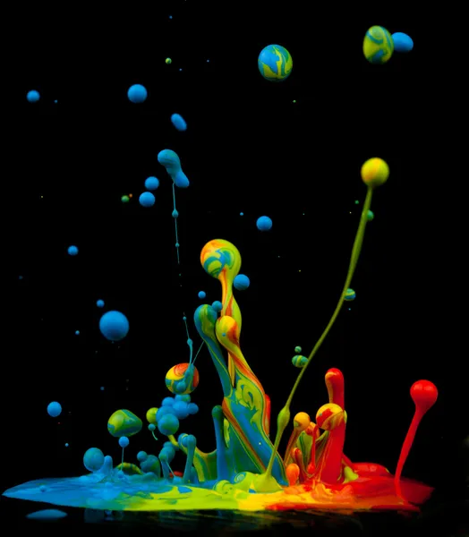 Colorful paint splashing — Stock Photo, Image