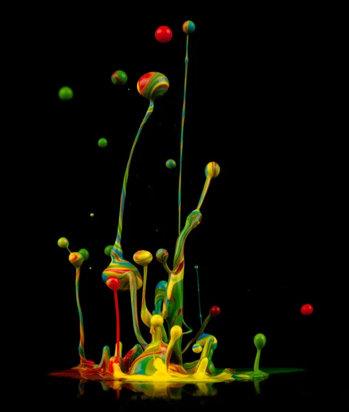 Colorful paint splashing — Stock Photo, Image