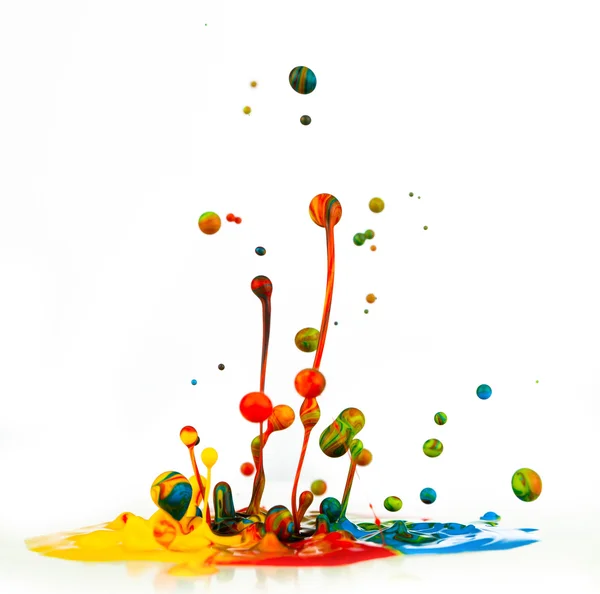 Colorful paint splashing — Stock Photo, Image