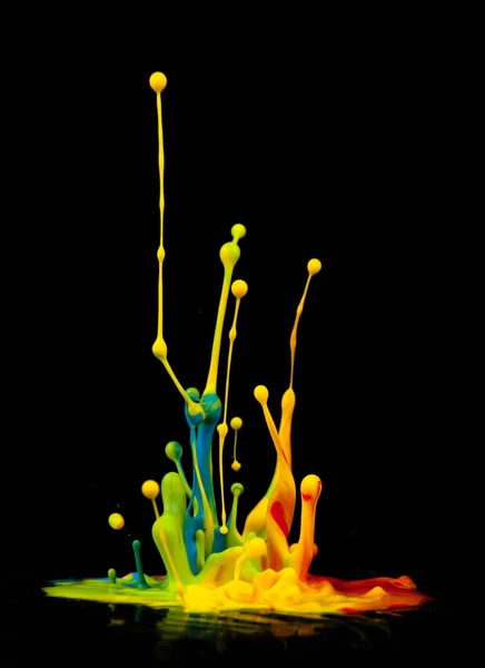 Colorful paint splashing — Stock Photo, Image