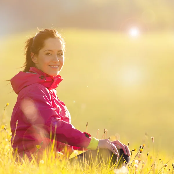 Pretty woman relaxing on a meadow — Stock Photo, Image