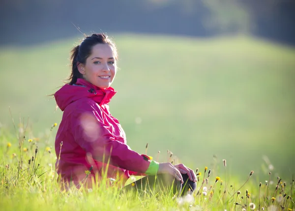 Pretty woman relaxing on a meadow — Stock Photo, Image