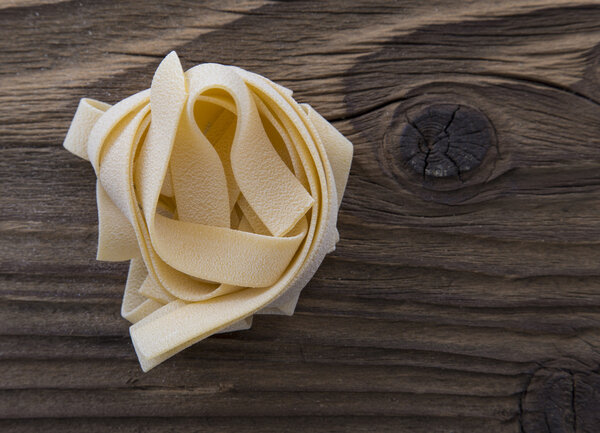 Spilled raw pappardelle pasta