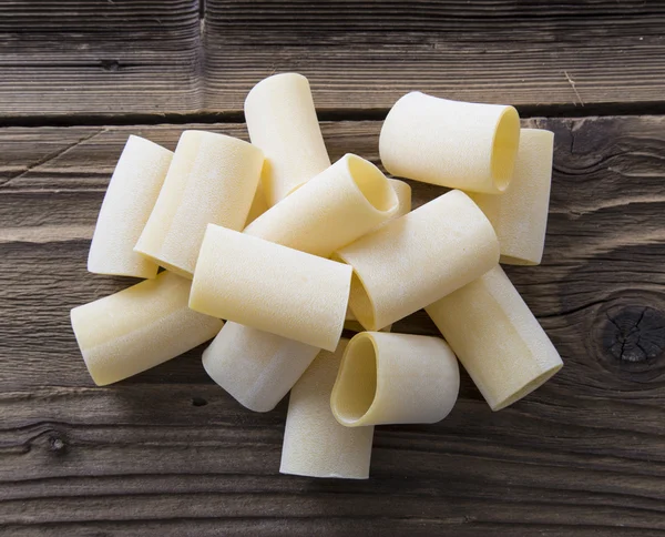 Spilled raw paccheri pasta — Stock Photo, Image