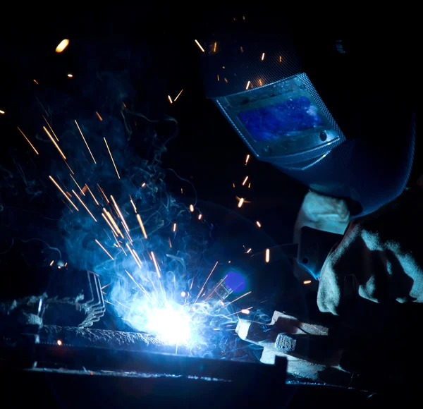 Welder in action with bright sparks. Stock Image Everypixel