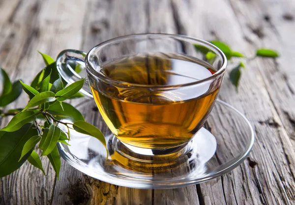 Taza transparente de té verde — Foto de Stock