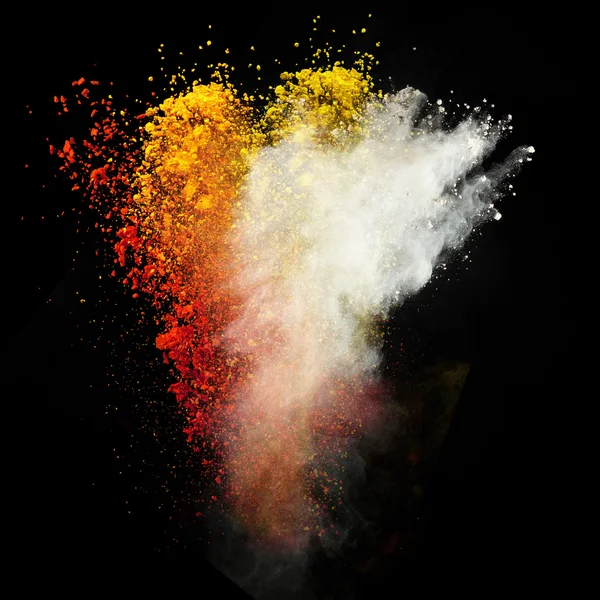 Launched colorful powder over black — Stock Photo, Image