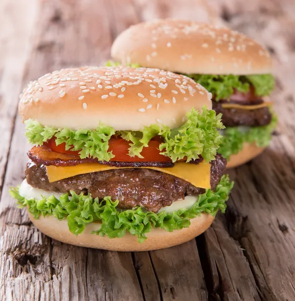 Delicious hamburger on wood — Stock Photo, Image