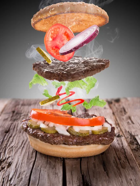 Delicious hamburger on wood — Stock Photo, Image