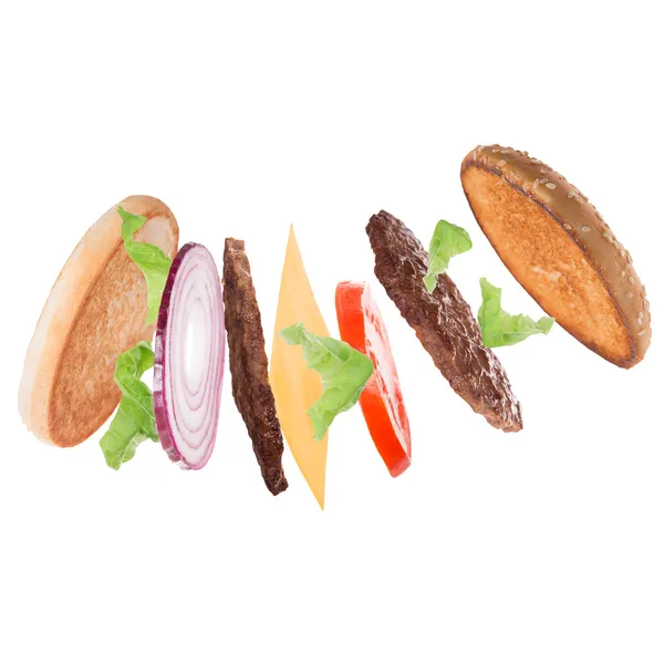 Läckra hamburgare med flygande ingredienser — Stockfoto