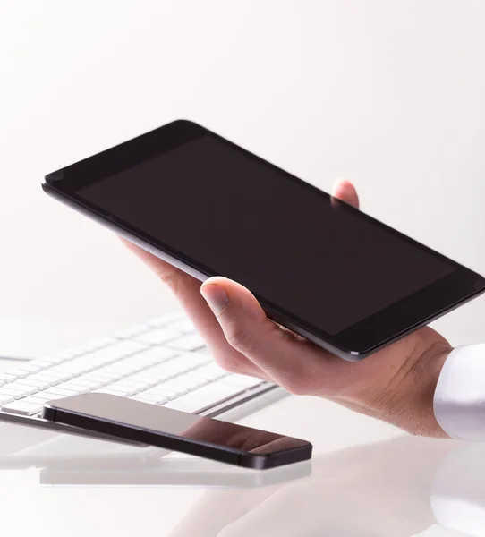 Hand touching digital tablet — Stock Photo, Image