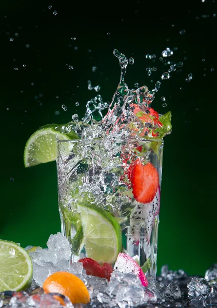 Fresh fruit cocktail with liquid splash — Stock Photo, Image