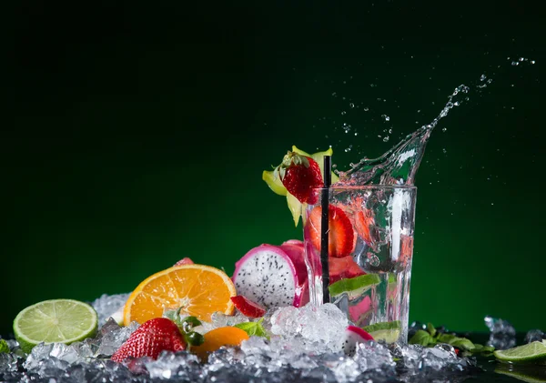 Fresh fruit cocktail with liquid splash — Stock Photo, Image