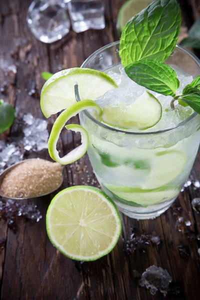 Fresh mojito cocktail on wooden table — Stock Photo, Image