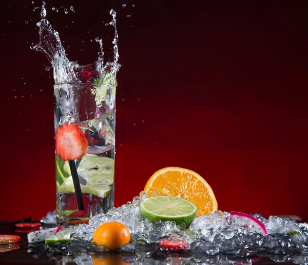 Fruit cocktail with splashing liquid — Stock Photo, Image