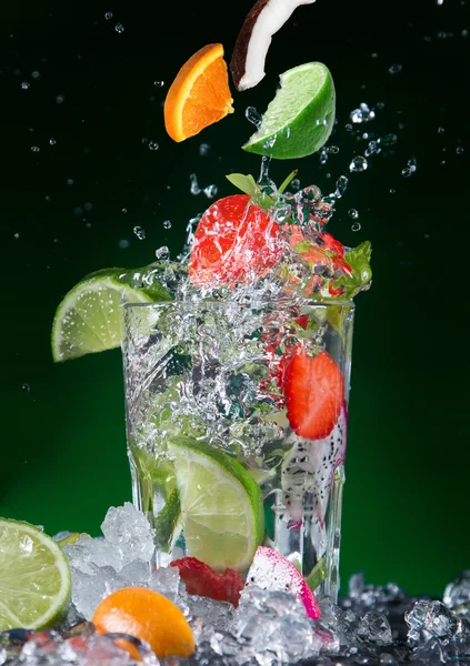 Fruit cocktail with splashing liquid — Stock Photo, Image