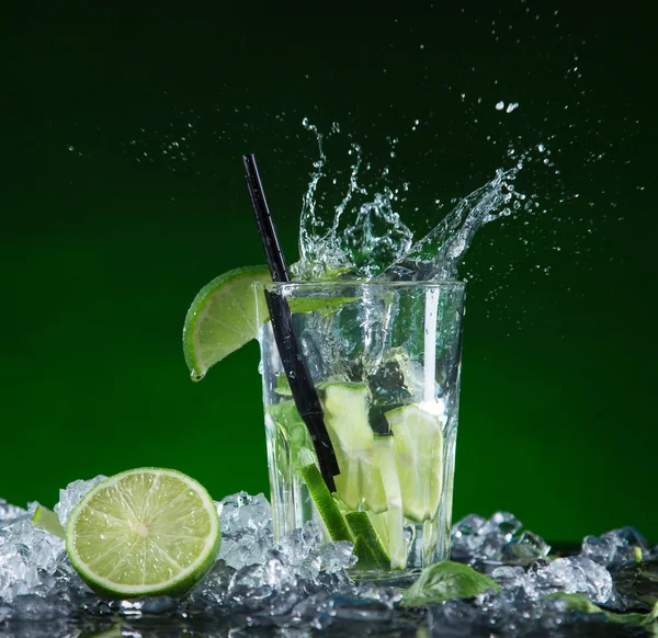 Fresh fruit cocktail in freeze motion splashing — Stock Photo, Image