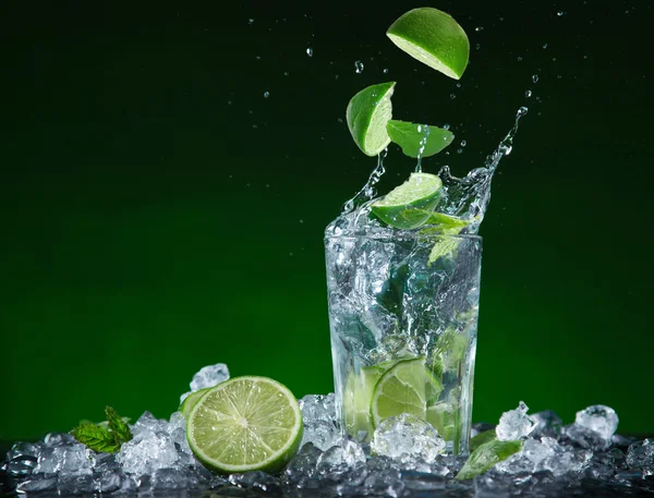 Fresh fruit cocktail in freeze motion splashing — Stock Photo, Image