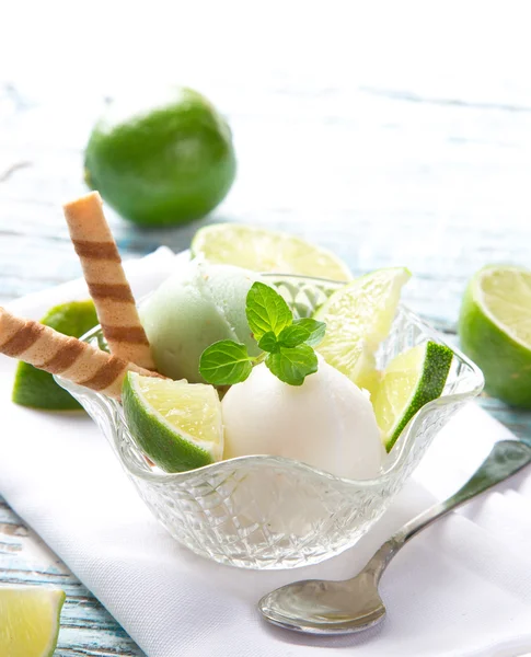 Ice cream scoops on wooden table — Stock Photo, Image