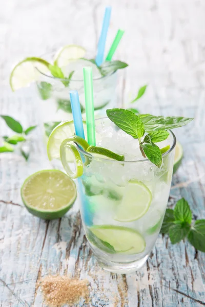 Fresh mojito cocktail on wooden table — Stock Photo, Image