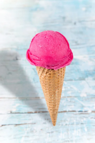 Ice cream scoops on wooden table — Stock Photo, Image